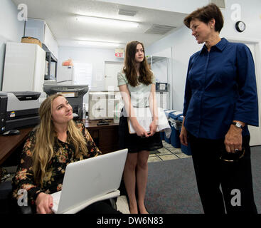 March. 01, 2014 - St. Petersburg, Florida, U.S. - ALEX SINK, right, Democratic candidate in Florida's 13th Congressional District race, chats with SHELLA SCULLY-HILBERT, left, and MALLORY STEWART ROBINSON at Pinellas County Democratic headquarters. Sink, Republican David Jolly and Libertarian Lucas Overby are competing for the seat left open when long-time Congressman Bill Young died in October of 2013. The special election will be held on Tuesday, March 11.(Credit Image: © Brian Cahn/ZUMAPRESS.com) Stock Photo