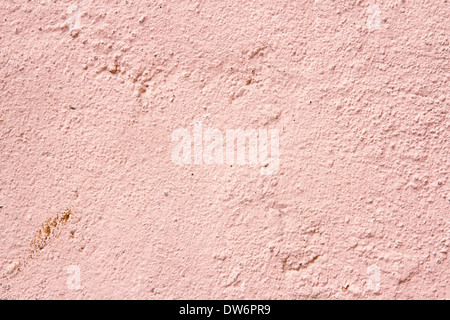 Plastered cream and pink color old cement wall background for copy space Stock Photo