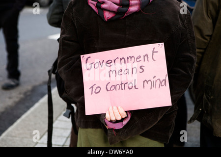 LONDON, ENGLAND - NOVEMBER 19: Students take part in a protest march against fees. placard "government means to control mind" Stock Photo