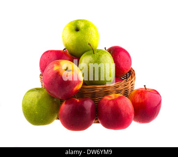 Fresh red and green apples in a wooden basket, isolated on white background. Stock Photo