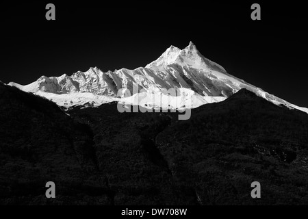 Manaslu, at 8156 meters (26,759 feet) high is the eighth highest peak on the planet. Stock Photo