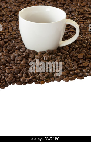 White Coffee cup standing between many coffee beans Stock Photo