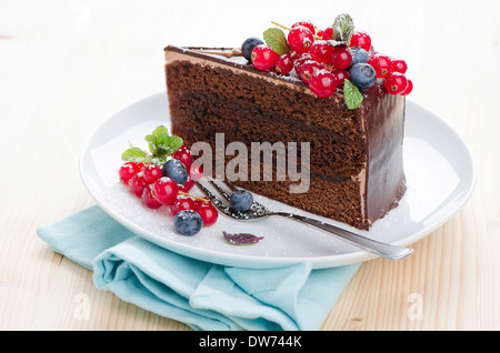 Sacher cake on a plate with berries Stock Photo
