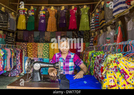 March 2, 2014 - Myawaddy, Kayin, Myanmar - A dress maker works in her shop in the market in Myawaddy, Myanmar. Myawaddy is separated from the Thai border town of Mae Sot by the Moei River. Myawaddy is the most important trading point between Myanmar (Burma) and Thailand. (Credit Image: © Jack Kurtz/ZUMAPRESS.com) Stock Photo