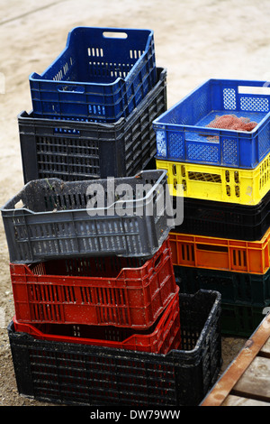 Vertical shot of some empty color crates. Stock Photo