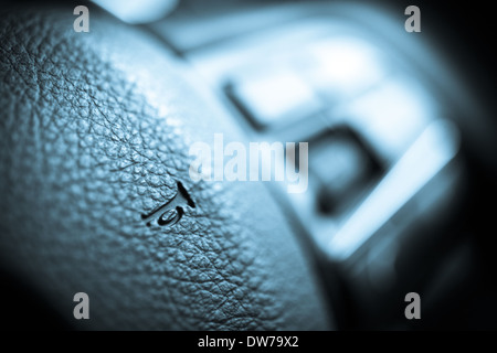 Close up shot of the horn button on a car's steering wheel Stock Photo