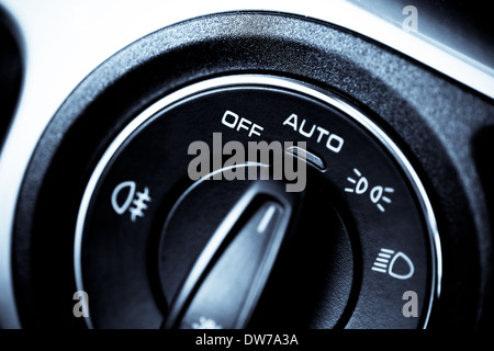 Detail of the headlight button in a car Stock Photo