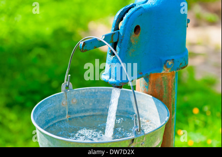 bucket full of water Stock Photo - Alamy