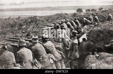 German troops firing from trenches under the direction of an officer during WWI. Stock Photo