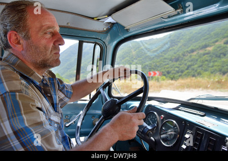 Man is driving car through passes of Zangezur Mountains, Armenia Stock Photo