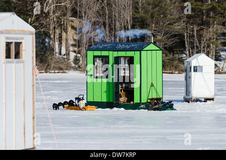 Smoke streams from the chimney of an ice fishing shack on Eagle Lake, Acadia National Park, Maine Stock Photo