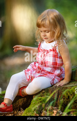 Little girl lost in the forest Stock Photo - Alamy