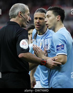 London. 2nd Mar, 2014. Samir Nasri(R) and Martin Demichelis (C) of Manchester City argues with referee Martin Atkinso during the Capital One Cup(The League Cup) Final between Manchester City and Sunderland at Wembley Stadium in London, Britain on March 2, 2014. Manchester City won 3-1. © Wang Lili/Xinhua/Alamy Live News Stock Photo