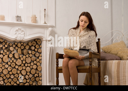 Elegant young woman in her living room Stock Photo