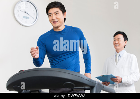 Doctor and patient in rehabilitation center Stock Photo