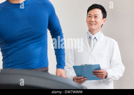 Doctor and patient in rehabilitation center Stock Photo