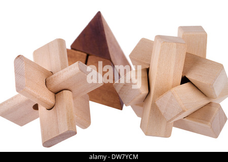 Wooden brain teasers on white background Stock Photo