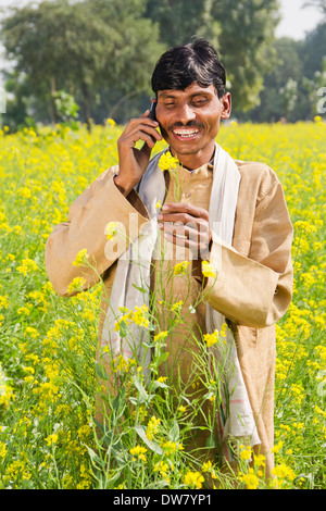 1 Indian farmer standing in farms and talking Stock Photo - Alamy