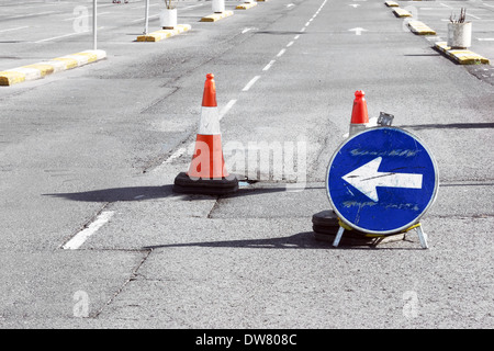 Road detour sign and cones due a pothole Stock Photo