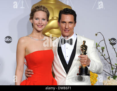 Hollywood, California, USA. 2nd Mar, 2014. After winning the category Performance by an actor in a Leading role for his role in 'Dallas Buyers Club', actor MATTHEW McCONAUGHEY poses with his Oscar and JENNIFER LAWRENCE in the press room at the 86th Annual Academy Awards held at the Dolby Theatre. Credit:  Lisa O'Connor/ZUMAPRESS.com/Alamy Live News Stock Photo