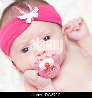 happy newborn baby girl just a week old photographed in the studio Stock Photo
