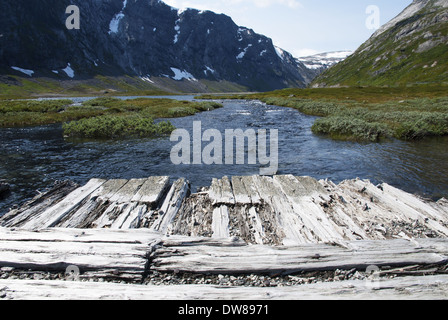 Wooden Planks with Copyspace in a Mountain Landscape above a River Stock Photo