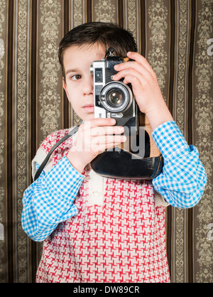 Boy with vintage camera. Vintage clothes Stock Photo