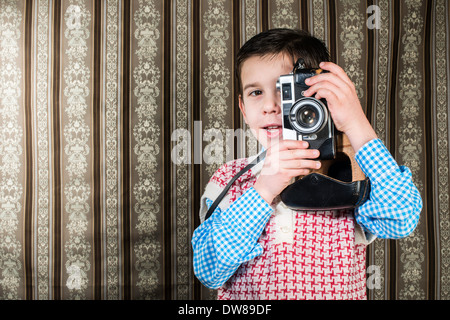 Boy with vintage camera. Vintage clothes Stock Photo