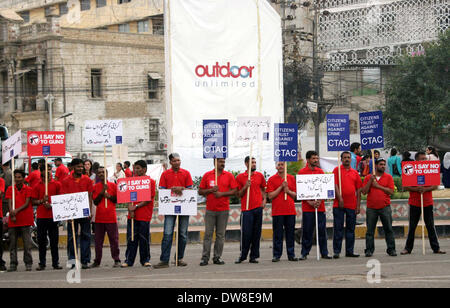 Members of NGO, Citizens Trust Against Crime (CTAC) are demonstrating in favor of Police Department while opposing terrorism, near Metro Pole Hotel in Karachi on Monday, March 03, 2014. Stock Photo