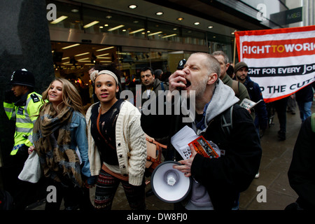 Right to Work activists hold a protest at Oxford Street central London 03 March 2012 Boycott Workfare have called for a day of action today across the UK over unpaid labor. The group opposes the use of unpaid workers and accuses businesses such as Tesco, Asda, Primark, HMV and Topshop of engaging in the practice. The main protest is expected to take place in Central London .(Photo by Tal Cohen) Stock Photo