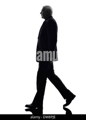 One Caucasian Senior Business Man walking Silhouette White Background Stock Photo