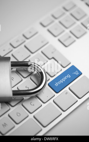 close-up view of a computer keyboard with a padlock next to shopping button Stock Photo