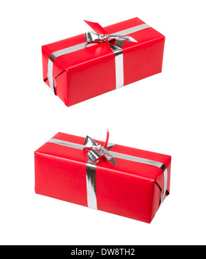 Red gift box with silver ribbon over white. Stock Photo