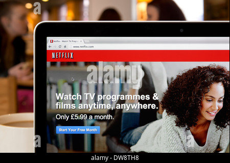 The Netflix website shot in a coffee shop environment (Editorial use only: print, TV, e-book and editorial website). Stock Photo