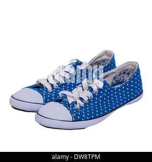 A pair of womens blue canvas pumps shoes on a white background Stock Photo