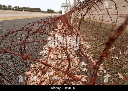 border eclectic fence coiled rusty barbed wire security perimeter Stock Photo
