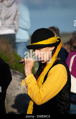 a young woman playing a flute Stock Photo
