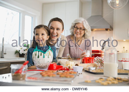 Three generation family baking cookies during Christmas