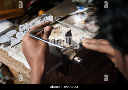 Colaba Causeway Mumbai a key-fob being hand made while customer waits. Stock Photo