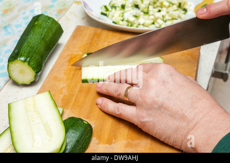 cook cucumber cut into small pieces Stock Photo
