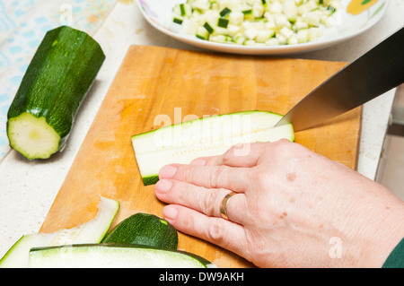 cook cucumber cut into small pieces Stock Photo