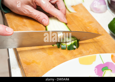 cook cucumber cut into small pieces Stock Photo