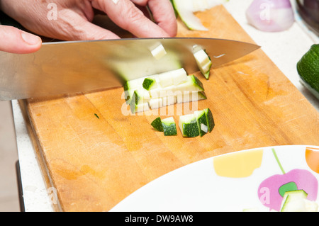 cook cucumber cut into small pieces Stock Photo