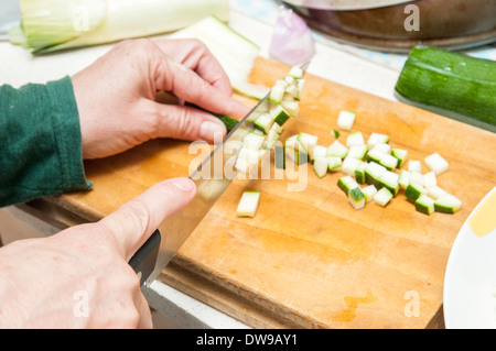 cook cucumber cut into small pieces Stock Photo