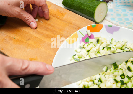 cook cucumber cut into small pieces Stock Photo