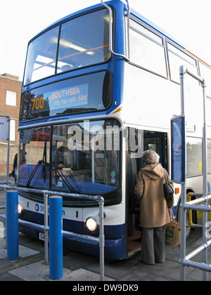 People boarding a 700 Coastliner Stagecoach bus at Chichester bus station West Sussex UK Stock Photo
