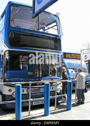 People boarding a 700 Coastliner Stagecoach bus at Chichester bus station West Sussex UK Stock Photo