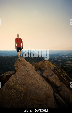 Mature male hiker standing on top of rock formation, Boulder, Colorado, USA Stock Photo