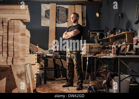 Portrait of mid adult man in carpenter workshop Stock Photo