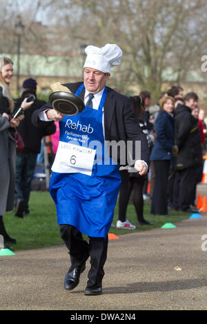 Westminster London, UK. 4th March 2014. Three teams made up of British MP's, members from the House of Lords and the Media go head to head in the 17th Rehab Annual Parliamentary pancake race to raise awareness for people with brain injury, mental health and other disabilities Credit:  amer ghazzal/Alamy Live News Stock Photo